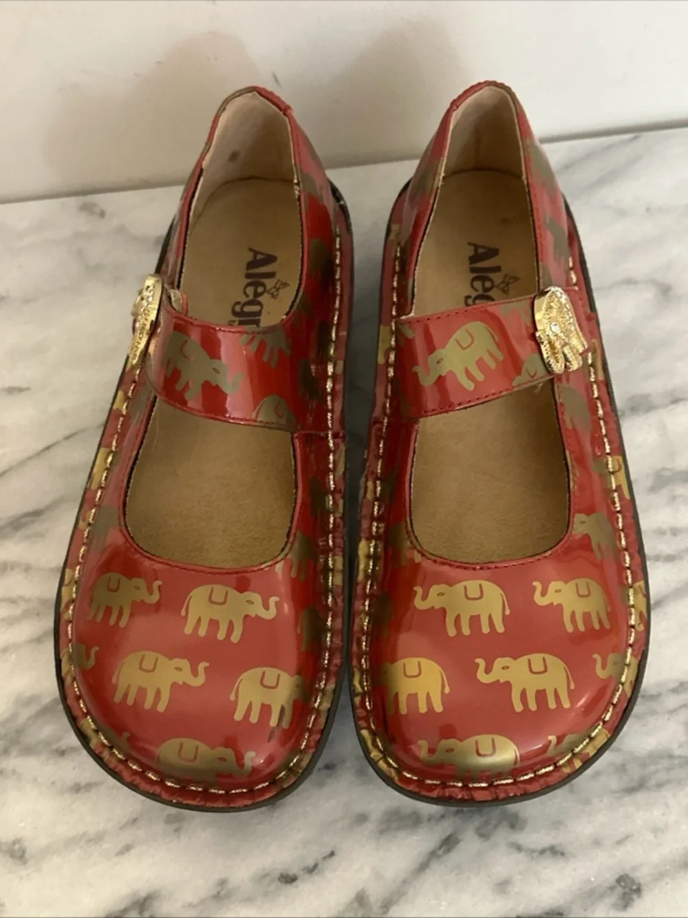 Alegria patent Red leather Mary Jane Platforms with Gold Elephant Accents